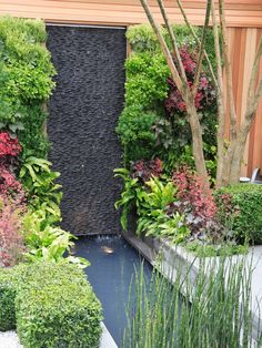 a water feature in the middle of a garden