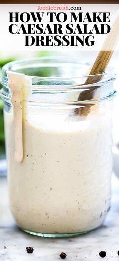 a jar filled with homemade caesar salad dressing