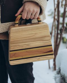 Welcome to my store! Wooden bag in the shape of a trapezoid. This is a unique, handmade wooden bag . This bag is carefully handcrafted, made entirely of natural strong wood, and has a beautiful chain or leather strap that is removable for those who want to carry this bag as a clutch. A very beautiful and original accessory. Made by hand from natural wood. Ash, apricot, mulberry, thermo wood An individual order is possible, taking into account your wishes. All fittings are silver, very good quality. Natural color. No dyes. Coating - water-based ECO varnish Italy SIZE: Bottom width 25 cm / 9,8 inches Upper width 20 cm / 7,8 inches Height 20 cm / 7,8 inches Thickness 7 cm / 2,7 inches Please contact me in case you have any questions about this item and I will try to reply as soon as possible. Wooden Bags Design, Wooden Handbag, Custom Woodworking Projects, Wood Purse, Wood Bag, Workbench Plans Diy, Kitchen Tools Design, Wooden Purse, Wooden Bag