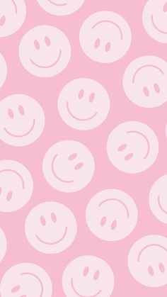 a pink background with white smiley faces