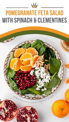 pomegranate feta salad with spinach and clementines in a bowl