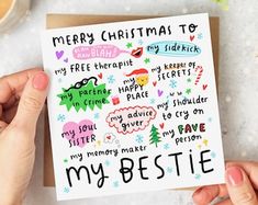 someone holding up a christmas card that says merry christmas to my bestie