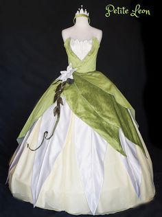 a green and white dress is on display