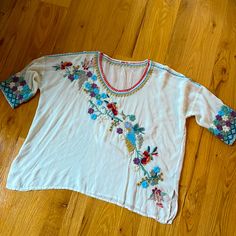 Beautiful Embroidered Johnny Was Top. Scoop Neck, 3/4 Sleeves, Notched Hem. Polyester. Machine Wash And Dry. New Without Tags. Bust: 28” Length: 26.5” Bohemian Tops With 3/4 Sleeve And Floral Embroidery, Summer Tops With Floral Embroidery And 3/4 Sleeve, Summer Floral Embroidery 3/4 Sleeve Tops, Summer Embroidered Tops With 3/4 Sleeves, Bohemian Half-sleeve Blouse With Floral Embroidery, Bohemian Blouse With Floral Embroidery And Half Sleeves, Bohemian Half Sleeve Blouse With Floral Embroidery, Spring Floral Embroidered Half Sleeve Top, Bohemian Top With Floral Embroidery And Half Sleeves