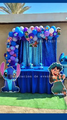 a table with balloons and decorations on it