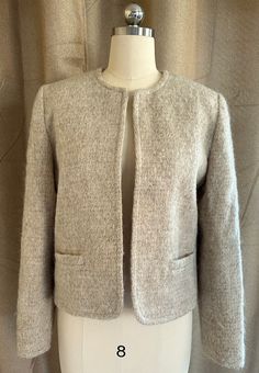 "pre-owned, good condition (see photos) wool, fully lined Size: 12 shoulder to the bottom of the coat is 21\", shoulder seam to shoulder seam 16\"" Cream Wool Blazer For Office, Classic Cream Wool Tweed Jacket, Cream Wool Blazer For Fall, Fall Cream Wool Blazer, Cream Tweed Jacket For Formal Fall Occasions, Formal Cream Tweed Jacket For Fall, Cream Wool Tweed Jacket With Long Sleeves, Cream Wool Tweed Jacket For Work, Classic Cream Tweed Jacket For Fall