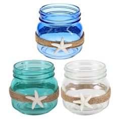 three mason jars with starfish lids and twine