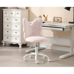 a white desk with a pink chair in front of it