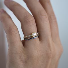 A luminously blue ring, set chock-full with sapphires. A very fancy stacking ring (yes please!), a subtle wedding band to sneak under your engagement ring, OR a wedding band and�engagement ring, all in one!�Financing options available in partnership with�Affirm. Wedding Band And Engagement Ring, Erstwhile Jewelry, Eternity Band Set, Personalized Charm Necklace, Custom Charm Necklaces, Sapphire Band, Ring Sapphire, Blue Ring, Pearl And Diamond Earrings