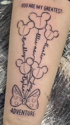 a person with a tattoo on their arm that says you are my greatest adventure and balloons