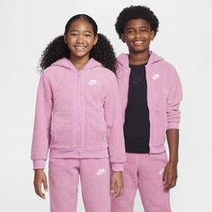 Just as cuddly soft as your favorite stuffed animal, this Club Fleece Hoodie is your ticket to staying comfortable in the cold. Its plush fleece has a thick, wooly feel that helps keep you extra warm and cozy. Crinkle woven taping and stretchy contrast ribbing top it off. Playful Fleece Hoodie Outerwear, Pink Hooded Fleece Jacket For Sports, Pink Winter Sports Fleece Jacket, Pink Fleece Jacket For Winter Sports, Nike Fleece Jacket With Fleece Lining, Sporty Pink Fleece Jacket With Fleece Lining, Pink Hooded Fleece Jacket, Hooded Pink Fleece Jacket, Sporty Pink Hooded Fleece Jacket