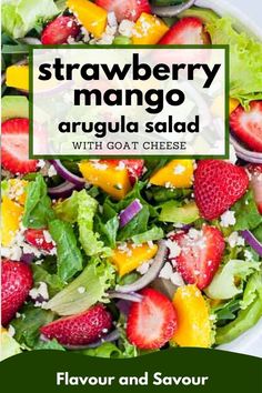 strawberry mango arugula salad with goat cheese and strawberries in a white bowl