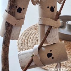 some toilet paper roll koalas hanging from a tree