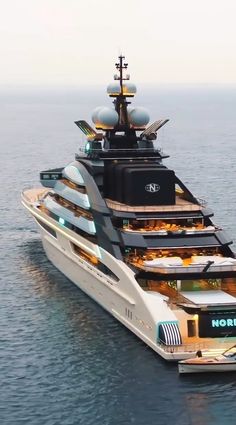 a large white boat floating on top of the ocean