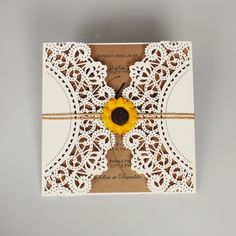 a card with a sunflower on it and a string attached to the front of it