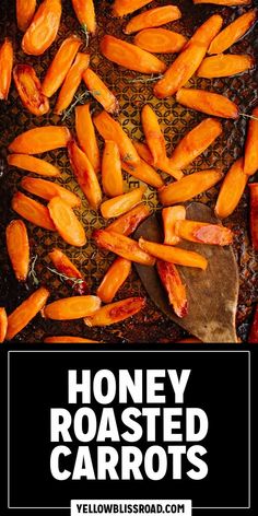 honey roasted carrots on a baking sheet with text overlay that reads honey roasted carrots