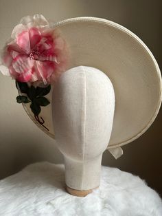 "This is a vintage 1950s hat featuring a chic statement flower on both the inside and outside of the brim. The hat is a deep ivory tone and is trimmed with an ivory velvet bow ribbon. This hat has its original designer tag which reads 'Reproduction of Maria-Guy 8,Place Vendome Paris.' This hat is in excellent vintage condition with only a few sections of faint discoloration to note.  Measurements: Interior Circumference: 19.5\" / Inside Depth: 1.5\" / Width: 14.5\" ALL SALES ARE FINAL. Unless ot Chic Cream Boater Hat For Garden Party, Cream Boater Hat With Flat Brim For Garden Party, Cream Fascinator With Short Brim For Garden Party, Beige Vintage Fascinator For Royal Ascot, Vintage White Top Hat For Formal Occasions, Vintage Beige Top Hat With Short Brim, Classic Beige Boater Hat For Garden Party, Cream Fascinator Hat For Garden Party, White Vintage Top Hat For Formal Occasions