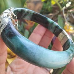 Item name: Hinged Jade Bangle Condition: New Material: Jade Outer shape: Round Inner Shape: Flat Shape: Flat Belly Shape Pattern: Natural Size: Large Color: Light Green Black Inner Diameter: 65.2 mm. Outer Diameter: 83 mm. Width: 13.6 mm. Thickness: 9.3 mm. Weight: 70 g. Style: Bangle Gender: Women's, Unisex's Spiritual Style Jade Bangle Jewelry, Carved Jade Bangle Bracelet, Adjustable Green Jade Bangle, Jade Bracelet Bangles Chinese, Green Hand-strung Jade Bracelets, Flat Shapes, Jade Bangle, Burmese, Shape Patterns