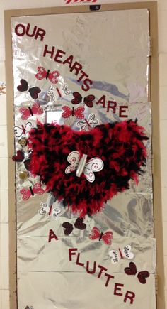 a bulletin board with hearts and words on it that says our hearts are a flutterer