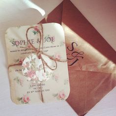 an envelope with a wedding card attached to it