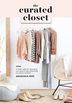 an open closet with clothes hanging on the rack and shoes sitting on the floor next to it