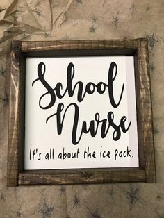 a wooden sign that says school nurse it's all about the ice pack hanging on a wall