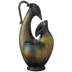 a bronze colored vase with two birds on it's back and water coming out of the top