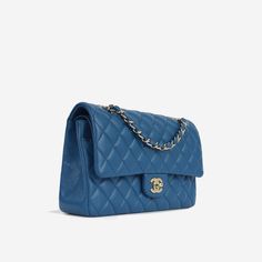 For timeless Parisian-chic there is no better investment than a Chanel classic flap bag. Created in blue caviar leather in the coveted Medium size remains the all-time best-seller at bagsalora. This Chanel comes with all the iconic features including multiple compartments and pockets. The interwoven chain sits elegantly on your shoulder or doubled up on your arm. SPL Exterior Blue caviar leather Champagne gold-tone hardware CC twist lock closure Slip pocket at rear of bag 2020 production Excelle Timeless Double Flap Bag, Timeless Business Bag With Double Flap, Classic Double Flap Office Bag, Timeless Double Flap Bag For Everyday Luxury, Chic Blue Bag With Cc Turnlock Closure, Blue Leather Shoulder Bag With Cc Turnlock Closure, Blue Flap Bag With Detachable Strap, Classic Blue Bag With Cc Turnlock Closure, Blue Shoulder Bag With Cc Turnlock Closure