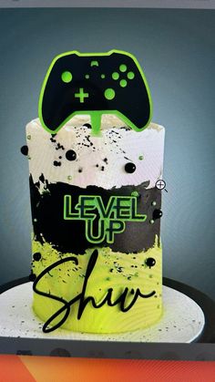 a video game themed cake with the words level up show on it's side