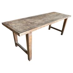 an old wooden table is shown against a white background with no one around it to see