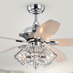 a ceiling fan with three crystal balls on it