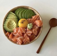 a wooden bowl filled with different types of food