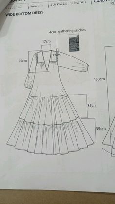 a drawing of a dress with measurements for the front and back, on top of a piece of paper