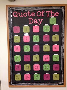 a blackboard with pink and green squares on it that says, quote of the day