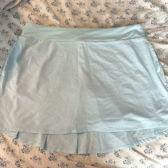 Nike Tennis Skirt Size Xl Never Worn Before Pockets On The Sides Zipper Pocket On The Back Built In Bike Shorts Back Is Slightly Longer Than The Front Small Stain On The Right Side (Picture Included) Measurements: ~ 19 Inches In The Waist L ~ 6 Inch Inseam ~ 16 Inches Top To Bottom In The Front ~ 19 Inches Top To Bottom In The Back Light Blue Stretch Mini Skirt, Light Blue Stretch Skirt, Nike Casual Short Skirt, Blue Casual Swim Skirt With Relaxed Fit, Blue Casual Relaxed Fit Swim Skirt, Casual Short Nike Skirt, Casual Blue Relaxed Fit Swim Skirt, Nike Pleated Tennis Skirt For Spring, Nike Spring Pleated Skirt