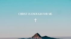 a cross on top of a mountain with the words christ is enough for me