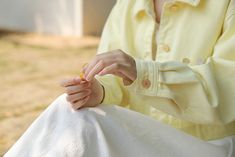 Cropped light yellow jacket with growing wildflower embroidery and belt loops. S: 15" across shoulders, 39" chest, 19" lengthM: 15.5" across shoulders, 40.5" chest, 19" lengthL: 16" across shoulders, 42" chest, 19.5" length Yellow Buttoned Spring Outerwear, Yellow Spring Outerwear With Buttons, Yellow Buttoned Outerwear For Spring, Yellow Embroidered Spring Outerwear, Spring Yellow Embroidered Outerwear, Embroidered Yellow Outerwear For Spring, Wildflower Embroidery, Grow Wildflowers, Yellow Jacket