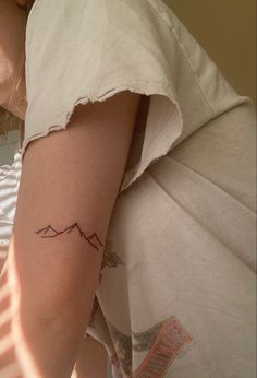 thin line upper arm mountain design tattoo by sacred rose tattoo in berkeley CAtattoo artist rachel giavasis. Mountains On Collar Bone Tattoo, 3 Mountain Tattoo, Mountain Range Line Art, Mountain Tattoo On Back Of Arm, Mountains Small Tattoo, Upper Tattoos Arm, Tattoo Of Mountains, Mountain Tattoo Placement Ideas, Mountain Tatoos Small Arm