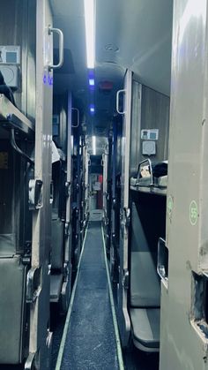 the inside of an empty train car with its doors open