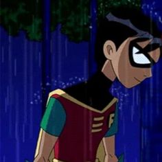 an animated image of a young man in the rain wearing a red and green costume