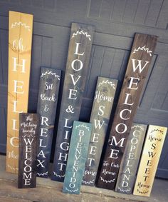 some wooden signs are sitting on the front steps and in front of a garage door