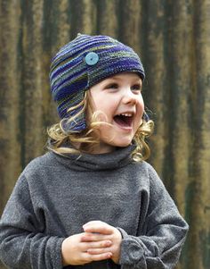 A fun Hat for chilly days on the playground, Aerial is a cute way to keep your little acrobats warm.\r\n\r\nSkills required:\r\nKnit & purl sts, knitting in the round, increases & decreases, short rows\r\n\r\nGauge \r\n27 sts x 38 rows to 4in/10cm on 2.75mm needles ov Bamboo Knitting Needles, Fun Hat, Earflap Hat, Hand Painted Yarn, Aviator Hat, Knitting Kit, Striped Midi Skirt, Hat Knitting, How To Purl Knit