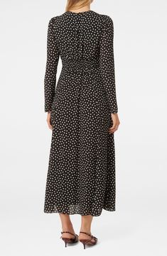 Worthy of celebration, this charming puff-shoulder maxi is sprinkled with allover dots that fall like confetti. 51" length Hidden side zip; keyhole with button-and-loop closure Jewel neck Long sleeves Lined 100% viscose Hand wash, line dry Imported Fitted Long Sleeve Polka Dot Maxi Dress, Elegant Long Sleeve Midi Dress With Ditsy Floral Print, Elegant Long Sleeve Maxi Dress With Ditsy Floral Print, Fall Midi Dress With Ditsy Floral Print, Fall Midi Length Ditsy Floral Print Dress, Long Sleeve Viscose Maxi Dress For Fall, Spring Long Sleeve Polka Dot Midi Dress, Spring Polka Dot Long Sleeve Midi Dress, Flowy Polka Dot Midi Dress