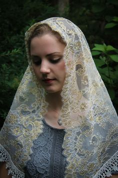 Evintage Veils~ A traditional gold/white mantilla veil, edged with an elegant Venise lace trim . It measures about 46 X 24 inches. A classic and traditional veil. Sewn-in clip is included with this veil. And, of course, it comes with our our complimentary organza bag! Convo us with any questions you may have, and Blessings! Our veils are custom made for you! Please see the Shipping & Returns section for our current processing times. Catholic Veils, Lace Headwrap, Chapel Veil Catholic, Catholic Veil, Mantilla Veil, Latin Mass, White Veils, Head Coverings, Beautiful Veil