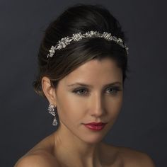 a woman wearing a tiara and smiling at the camera