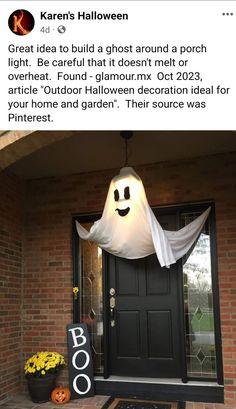 a front door decorated for halloween with a ghost