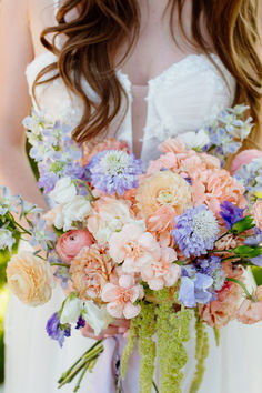 A Bride Holding Her Bouquet Of Flowers Lavender Color Bouquet, Garden Party Wedding Bouquet, Lavender And Peach Wedding, Lavender Scabiosa, Wildflower Wedding Ceremony, Spring Pastel Wedding, Spring Flowers Wedding, Soft Pastel Flowers, Pastel Bridal Bouquet