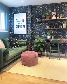 a living room filled with furniture and a green couch