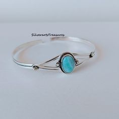 Larimar Bangle, Dainty Bangle, Statement Bangle, Handmade Bangle, Gemstone Bangle, Natural Larimar, Adjustable Bangle, Larimar Jewelry Benefit Larimar Gemstone Larimar is said to enlighten and heal in a physical, emotional, mental and spiritual way. It stimulates the heart, throat, third eye and crown chakras facilitating inner wisdom and outer manifestation. It represents peace and clarity, radiating healing and love energy. Larimar can also be used to soothe stress-related health worries such Adjustable Round Turquoise Bangle, Adjustable Bohemian Oval Bracelet, Adjustable Oval Turquoise Sterling Silver Bracelet, Adjustable Bohemian Sterling Silver Oval Bracelet, Adjustable Oval Bracelet With Natural Stones, Adjustable Oval Spiritual Bracelets, Larimar Bracelet, Larimar Jewelry, Gemstone Bangle