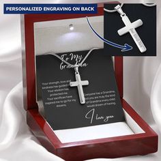 an open box with a cross on it and a card attached to the necklace that says, personalized engraving on back